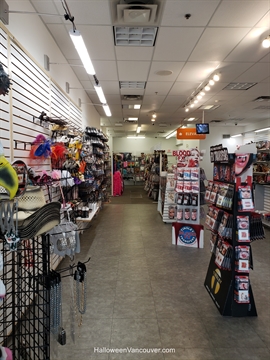 Mask collections stacked at downtown storefront rows