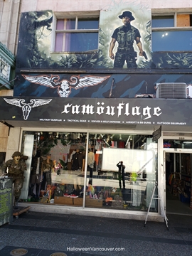 The neon lit interior pathways of Camouflage Military Surplus on Granville Street